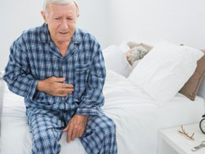 elderly in pain in bed
