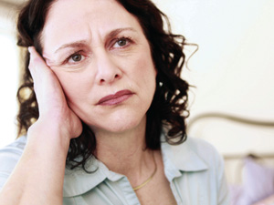 middle aged women angry with diagnosis of elderly mother