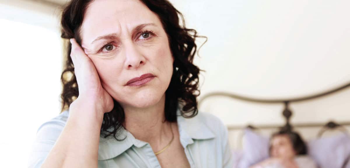 middle aged women angry with diagnosis of elderly mother